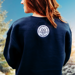 https://bonafidephoto.com Photo of @happyvalleyhannah wearing navy crew neck sweater with white embroidered badge logo 'the happiest valley, established 2024' Perfect for Penn State fans and nostalgia for good times in happy valley / State College, PA