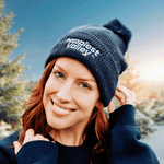https://bonafidephoto.com Photo of @happyvalleyhannah smiling while wearing navy speckled beanie with white embroidered logo 'happiest valley.' Perfect for Penn State fans winter wear, staying cozy, and nostalgia for good times in happy valley / State College, PA