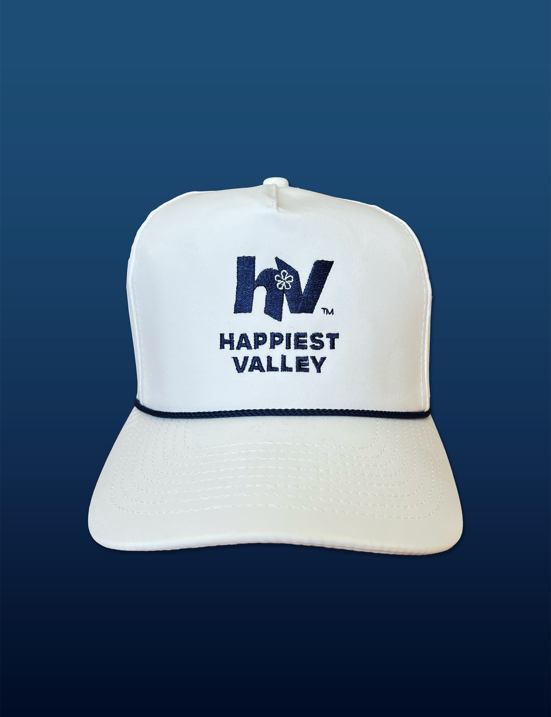 White baseball hat / baseball cap with navy embroidered logo 'happiest valley' and navy cord. Perfect for Penn State fans and nostalgia for good times in happy valley / State College, PA / casual and trending