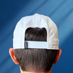 @happyvalleyhannah's husband Paul wearing White baseball hat / baseball cap with navy embroidered logo 'happiest valley' and navy cord. Back view showing a snapback adjustable sizing. Perfect for Penn State fans and nostalgia for good times in happy valley / State College, PA / casual and trending